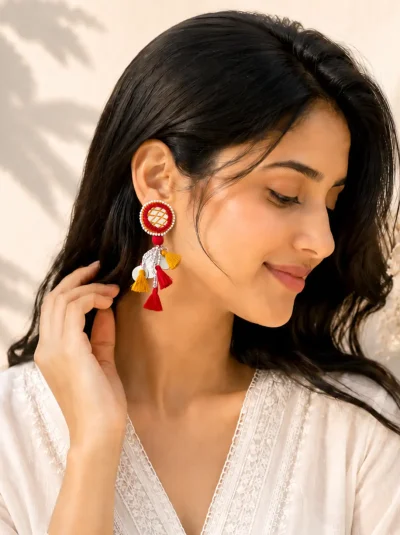 Handmade mirror work tassel earrings with red and yellow threadwork, beads, silver coin charms and boho ethnic design for women