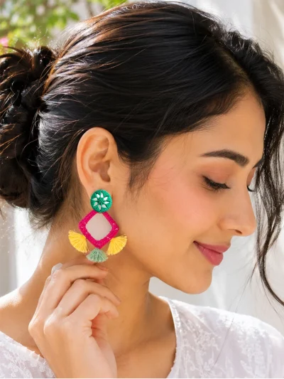 Handmade mirror work tassel earrings with colorful thread work, pink diamond frame, green woven top, and decorative tassels.